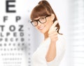 Woman in eyeglasses with eye chart Royalty Free Stock Photo