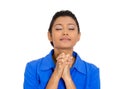 Woman eyes closed praying hoping for the best