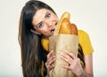 Woman face close up portrait, girl bites bread. Royalty Free Stock Photo
