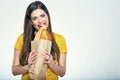 Woman face close up portrait, girl bites bread. Royalty Free Stock Photo