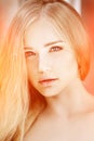 Woman face close up. A pretty young blond trendy. Girl with a be Royalty Free Stock Photo