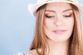 Woman face colorful eyes makeup, summer straw hat smiling Royalty Free Stock Photo