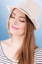 Woman face colorful eyes makeup, summer straw hat smiling Royalty Free Stock Photo