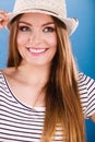 Woman face colorful eyes makeup, summer straw hat smiling Royalty Free Stock Photo