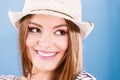 Woman face colorful eyes makeup, summer straw hat smiling Royalty Free Stock Photo