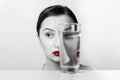 Woman Face Distortion In Water Glass Royalty Free Stock Photo