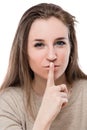 Woman face with finger near lips Royalty Free Stock Photo