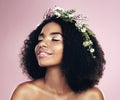 Woman, face and flower crown for beauty in studio, pink background and natural glowing skincare. African, female model