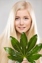 Woman Face Hair Treatment, Fresh Exotic Palm Leaf, Young Smiling Model Beauty Portrait Natural Makeup Royalty Free Stock Photo