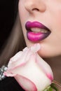 Woman face with lilac Lips and Rose Flower. Royalty Free Stock Photo