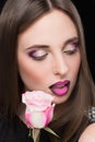 Woman face with lilac Lips and Rose Flower. Royalty Free Stock Photo