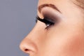 Woman face with long eyelashes and smokey eyes make-up. Eyelash extensions, makeup, cosmetics, beauty Royalty Free Stock Photo