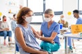 Woman with face mask getting vaccinated, coronavirus, covid-19 and vaccination concept. Royalty Free Stock Photo