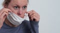 Woman with face mask protecting herself from coronavirus stock photo