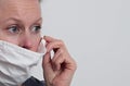 Woman with face mask protecting herself from coronavirus stock photo