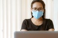 Woman with face mask protection while working, Coronavirus, air pollution, allergy sick woman with medical mask