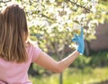 Woman with face mask on quarantine. Stay at home. Family concept. young woman blowing dandelion. glass of champagne on the beach.G