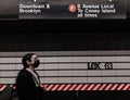 Woman with Face Mask Waiting for Train at MTA Subway Platform NYC