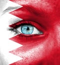 Woman face painted with flag of Bahrain