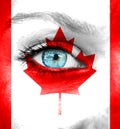 Woman face painted with flag of Canada Royalty Free Stock Photo