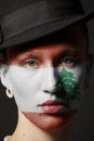 Woman face with painted Flag of Lebanon