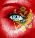 Woman face painted with flag of Montenegro