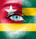 Woman face painted with flag of Togo