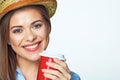 Smiling girl posing on white background with red coffee cup. Royalty Free Stock Photo