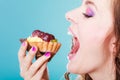 Woman face profile open mouth eating cake