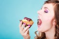 Woman face profile open mouth eating cake Royalty Free Stock Photo