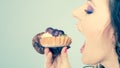 Woman face profile open mouth eating cake Royalty Free Stock Photo