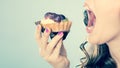 Woman face profile open mouth eating cake