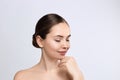 Woman Face Skin Care. Closeup Beautiful Sexy Woman With Perfect Professional Makeup Touching Her Smooth Soft Pure Clean Skin Royalty Free Stock Photo