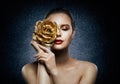 Woman Face Skin Care Flower Gold Mask. Beautiful Fashion Girl with Rose Jewelry on Face. Night Treatment Product Royalty Free Stock Photo