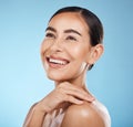 Woman, face and smile, happy and beauty with natural cosmetics and glow isolated against blue background. Clean