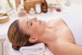 Woman, face and top view with eyes closed at spa, massage and wellness with calm for zen and self care. Cosmetics Royalty Free Stock Photo