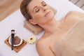 Woman, face and top view for facial at spa, massage and wellness with calm for zen and self care. Cosmetics, beauty and