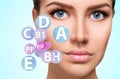 Woman face with vitamins icons. Healthy skin concept.