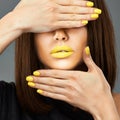 Woman face. Yellow nail. Blue lips.