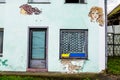 Woman faces on a house wall