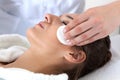 Woman during facial cleansing in spa