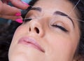 Woman on facial hair removal threading procedure Royalty Free Stock Photo