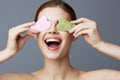 woman facial scraper skin care posing background