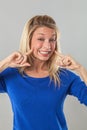 Woman with a fake dental smile expressing convictions Royalty Free Stock Photo