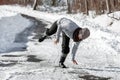 Woman is falling on the road at the winter season, black ice and danger