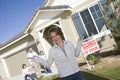 Woman With Family Standing In Front Of House For Sale Royalty Free Stock Photo