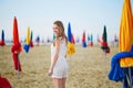 Woman with famous colorful parasols on Deauville Beach in France Royalty Free Stock Photo