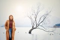 Woman at The famous Wanaka tree or Lonely Tree of Wanaka, at lake Wanaka , South Island, New Zealand