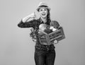 Woman farmer with box of vegetables showing call me gesture