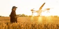 Woman farmer controls drone with a tablet